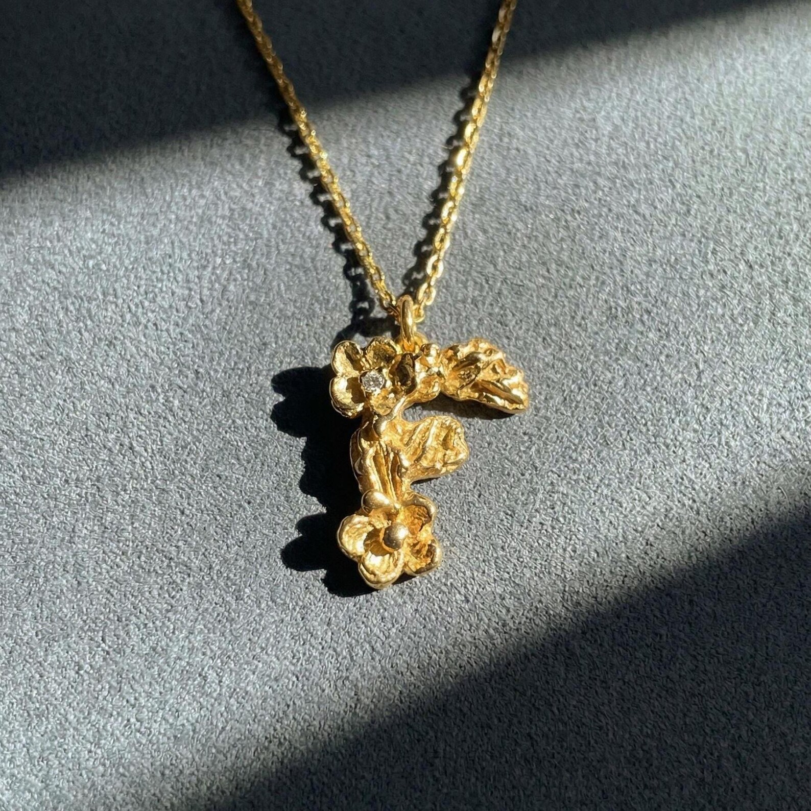 Handcrafted gold pendant detail